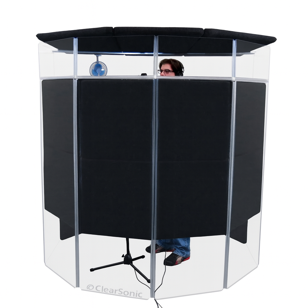 Clear soundproof booth with black interior and clear sides, featuring a person inside.