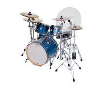 A blue DW drum set with a Flector22 cymbal shield blocking a cymbal 