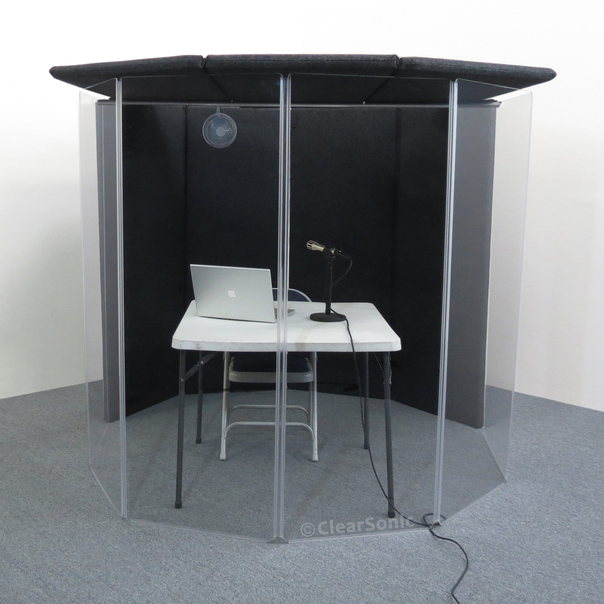 IsoPac I translation and podcasting isolation booth with a table, chair