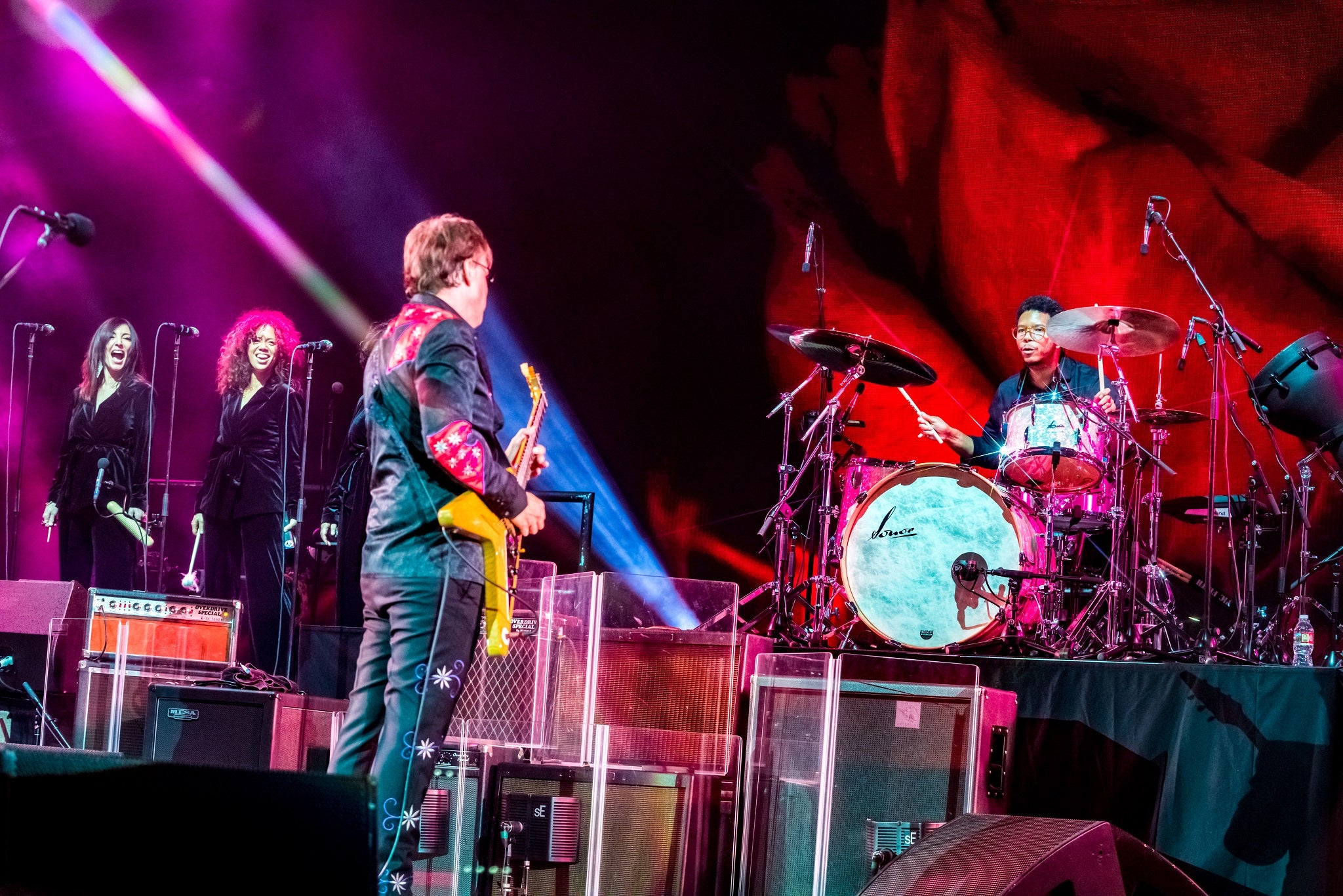 Joe Bonamassa on stage with his band with multiple ClearSonic JB-4 signature amp shields. 