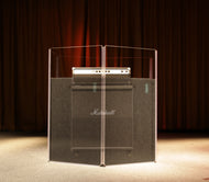 An AmpPac 41 with acrylic shield and sorber absorption baffles isolating a Marshall 4x12 cabinet on a stage.