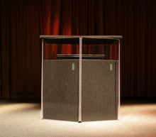 AmpPac 51 isolation booth on a stage surrounding a Leslie speaker