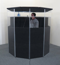 A vocalist being isolated from external sound sources by an IsoPac E.