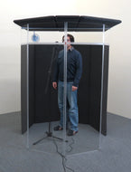 A person recording voice-overs inside an IsoPac F vocal booth.